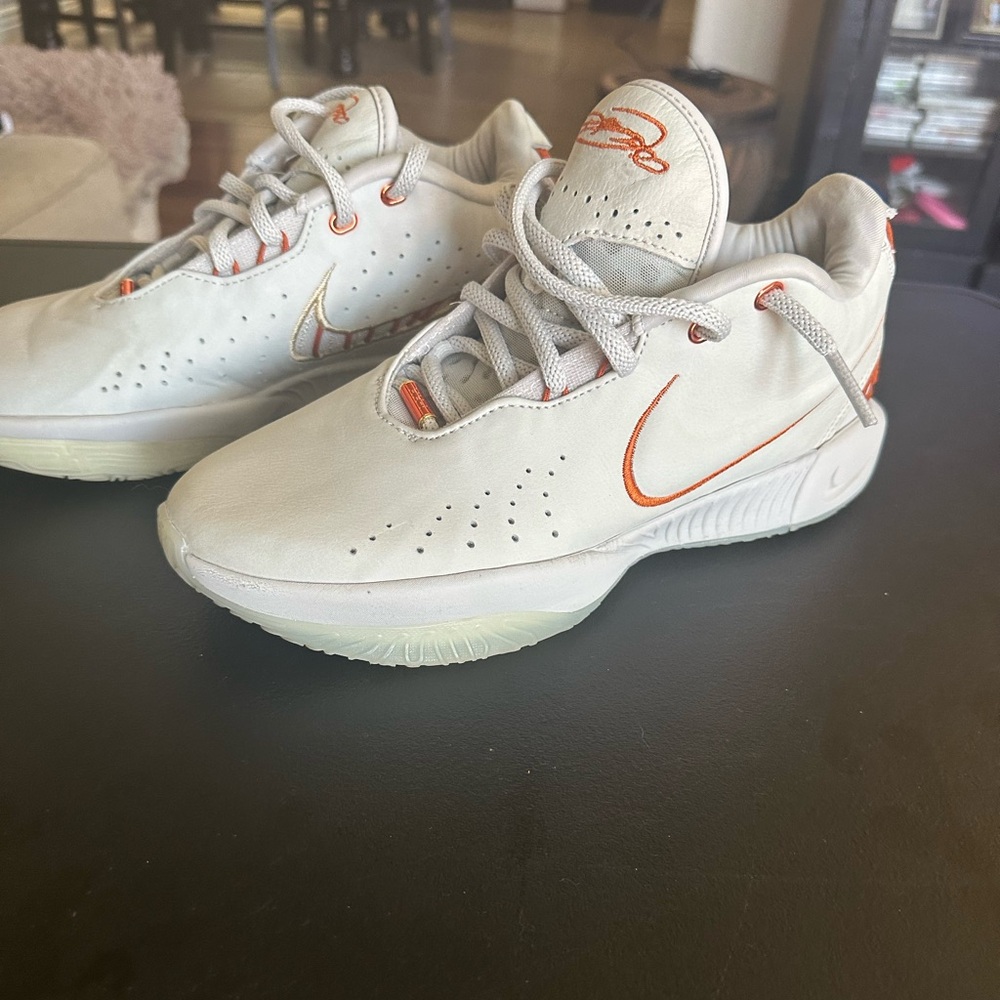 The product in the image is the Nike LeBron 21 “Akoya” basketball shoe
